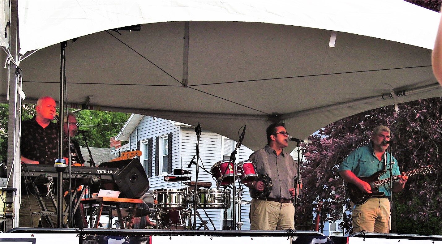 Blue Eyed Soul band playing live music on a stage.
