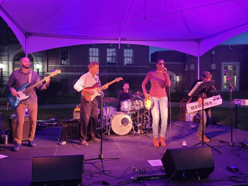 Top Shelf band playing music on stage.