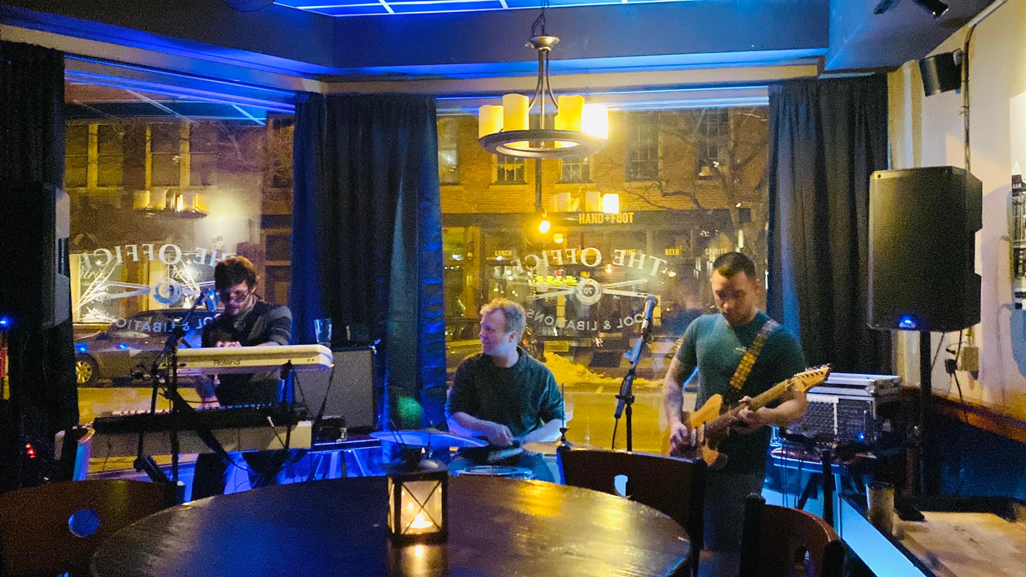 Cosmic Bear band playing live music at a bar.