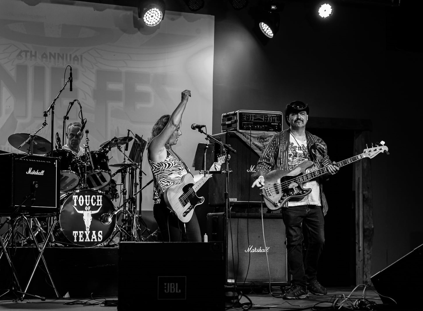 B-3 Band playing live music on stage.