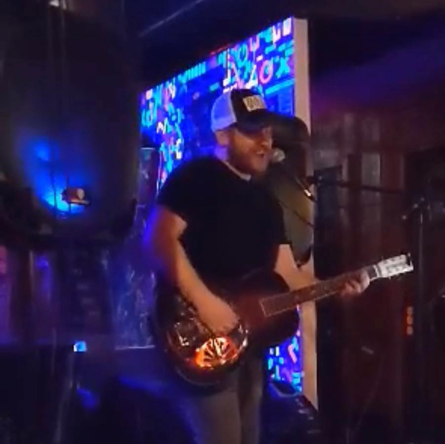 Trevor Clark playing guitar.