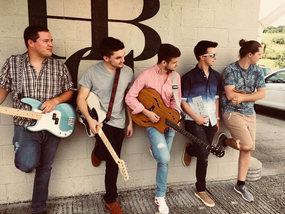 The Variables Band posing against a wall.