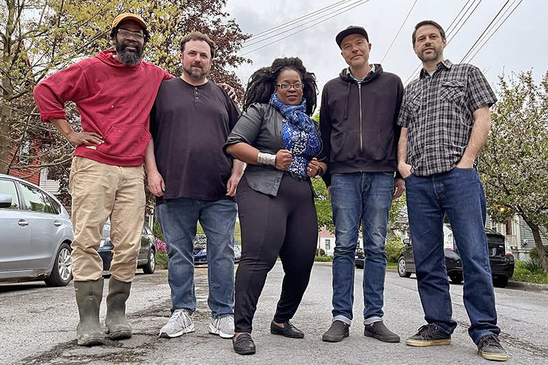 SingTrece and Stone Cold Miracle band posing for photo.